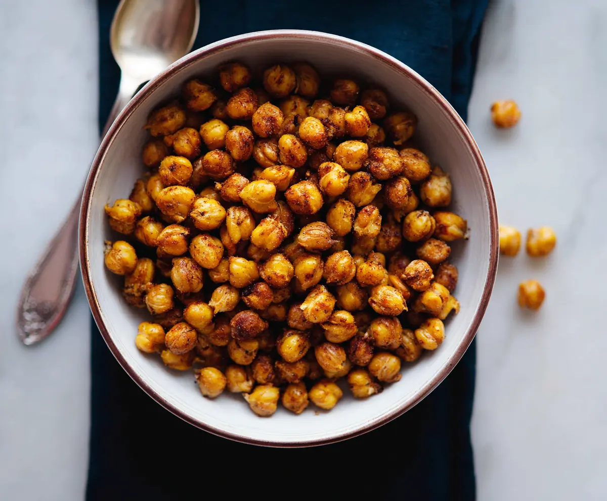 Crispy roasted chickpeas seasoned with spices, perfect for healthy snacking.