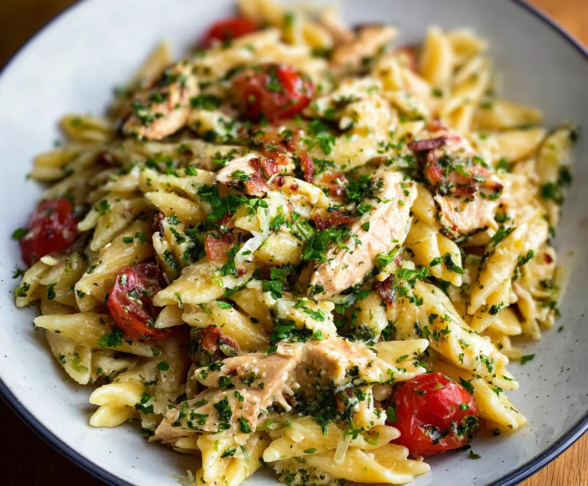 Delicious rotisserie chicken pasta dish with creamy sauce and fresh herbs